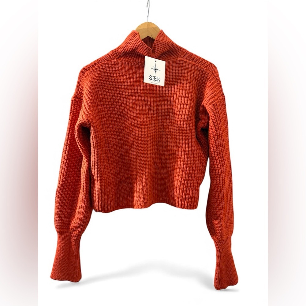SEEK THE LABEL Cropped Waist Turtleneck knit Sweater in a rust/orange .
Size XS